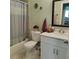 Well-maintained bathroom with a shower-tub combo, white vanity, and stylish décor at 6690 54Th N Ave, St Petersburg, FL 33709