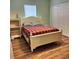 Comfortable bedroom with wood floors, a bright window, and a spacious closet at 6690 54Th N Ave, St Petersburg, FL 33709