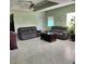 Spacious living room with ample seating and large windows allowing natural light to fill the space at 6690 54Th N Ave, St Petersburg, FL 33709