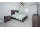 A bedroom with a bed, nightstand, and dresser with tiled floors at 801 Russell Ln # 255, Brandon, FL 33510