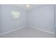 Neutral-toned bedroom with ceiling fan and bright natural light from a window at 801 Russell Ln # 255, Brandon, FL 33510