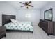 A bedroom with a bed, nightstand, and dresser featuring tile flooring at 801 Russell Ln # 255, Brandon, FL 33510