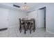 A dining area featuring a table with seating for four with gray cushioned chairs at 801 Russell Ln # 255, Brandon, FL 33510