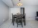 A well-lit dining area featuring a dining table, four chairs, tile floors, and a sliding door closet at 801 Russell Ln # 255, Brandon, FL 33510