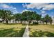 Well-maintained building exteriors with mature trees offering shaded, green spaces and a tranquil atmosphere at 801 Russell Ln # 255, Brandon, FL 33510
