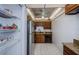 A fully equipped kitchen with stainless steel refrigerator and dark brown cabinetry at 801 Russell Ln # 255, Brandon, FL 33510