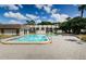 Inviting community pool with clear water, surrounded by well-maintained brick pavers and lush landscaping at 801 Russell Ln # 255, Brandon, FL 33510