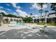 Community pool surrounded by lounge chairs and tables at multi-Gathering home at 801 Russell Ln # 255, Brandon, FL 33510