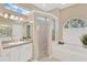 Serene primary bathroom with separate tub and shower, dual sinks and large window for natural light at 8902 30Th E St, Parrish, FL 34219