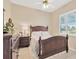 Cozy bedroom with traditional decor featuring a wooden bed frame and ample natural light at 8902 30Th E St, Parrish, FL 34219