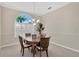 Cozy dining room with a round table, seating for four, and a large window for natural light at 8902 30Th E St, Parrish, FL 34219