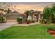 Charming home with a well-manicured lawn, a two car garage, and mature landscaping at 8902 30Th E St, Parrish, FL 34219