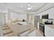 Bright, modern kitchen featuring an island with bar seating, stainless steel appliances, and white cabinetry at 8902 30Th E St, Parrish, FL 34219