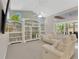 Spacious living room featuring custom built-in bookshelves and a large window for natural light at 8902 30Th E St, Parrish, FL 34219