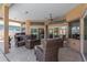 Relaxing screened patio boasts a ceiling fan and comfortable seating, perfect for enjoying the outdoors at 8902 30Th E St, Parrish, FL 34219