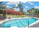 Inviting private pool inside screen enclosure with lush landscaping provides a tranquil oasis at 8902 30Th E St, Parrish, FL 34219