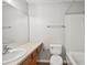 Standard bathroom featuring a large mirror, single sink vanity, tile floors, and bathtub with shower at 10407 Westpark Preserve Blvd, Tampa, FL 33625