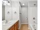 Well-lit bathroom featuring a single sink vanity with a shower and bathtub combination at 10407 Westpark Preserve Blvd, Tampa, FL 33625