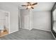 Bedroom with neutral carpeting featuring an ensuite bathroom and natural light at 10407 Westpark Preserve Blvd, Tampa, FL 33625