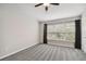 Bedroom with large window, neutral color scheme and carpeting at 10407 Westpark Preserve Blvd, Tampa, FL 33625