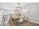Dining area features a stylish light fixture and view to the kitchen at 10407 Westpark Preserve Blvd, Tampa, FL 33625