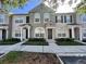 Charming townhome featuring well-maintained landscaping and neutral-toned exterior at 10407 Westpark Preserve Blvd, Tampa, FL 33625