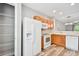 Efficient kitchen with pantry, white appliances and wooden cabinets at 10407 Westpark Preserve Blvd, Tampa, FL 33625