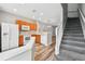 Bright kitchen features wooden cabinets, white appliances, and adjacent staircase at 10407 Westpark Preserve Blvd, Tampa, FL 33625