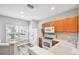Well-lit kitchen boasts a large window and wooden cabinets at 10407 Westpark Preserve Blvd, Tampa, FL 33625