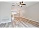 Bright living room with wood look floors, recessed lights, and view to the kitchen at 10407 Westpark Preserve Blvd, Tampa, FL 33625