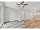 A spacious living room is bright with neutral walls and varied wood-look vinyl plank flooring at 10407 Westpark Preserve Blvd, Tampa, FL 33625