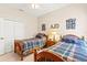 bedroom with twin beds and wood frame with ceiling fan at 11534 Biddeford Pl, New Port Richey, FL 34654