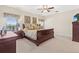 This bedroom offers a king bed, wood furniture, and view of the lake at 11534 Biddeford Pl, New Port Richey, FL 34654