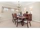 Cozy dining room featuring carpeted floors and a chandelier, perfect for Gathering gatherings at 11534 Biddeford Pl, New Port Richey, FL 34654