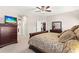 This bedroom features a bed, TV, and an ensuite bathroom at 11534 Biddeford Pl, New Port Richey, FL 34654
