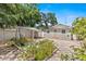 Inviting backyard showcasing a charming tiled patio, a covered area, and lush landscaping, perfect for outdoor entertaining at 1209 E 29Th Ave, Tampa, FL 33605