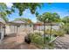 Cozy backyard featuring a partially covered patio, a charming pergola, and unique tiled flooring, ideal for relaxation at 1209 E 29Th Ave, Tampa, FL 33605