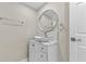 Bathroom with a modern vessel sink, oval mirror, and marble accents at 1209 E 29Th Ave, Tampa, FL 33605