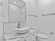 Well-lit bathroom featuring a modern vessel sink and marble-style shower at 1209 E 29Th Ave, Tampa, FL 33605