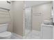 Modern bathroom featuring a glass shower, marble tile, and decorative vessel sink at 1209 E 29Th Ave, Tampa, FL 33605