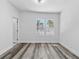 A serene bedroom features neutral walls, modern flooring, recessed lighting, and an inviting atmosphere at 1209 E 29Th Ave, Tampa, FL 33605