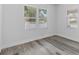 Bright, minimalist bedroom featuring wood floors and natural light at 1209 E 29Th Ave, Tampa, FL 33605
