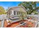 Classic home with stone and siding, complemented by a small front yard and mature trees in a quiet neighborhood at 1209 E 29Th Ave, Tampa, FL 33605