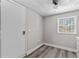 Eat-in kitchen with utility door and window; modern gray-wood flooring and plenty of light at 1209 E 29Th Ave, Tampa, FL 33605