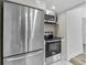 Modern kitchen with stainless steel appliances, including a refrigerator and oven at 1209 E 29Th Ave, Tampa, FL 33605