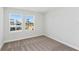 Bedroom with bright windows overlooking the neighborhood and neutral carpet at 12156 Cattleside Dr, Riverview, FL 33579