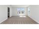 Sun-filled bedroom with carpet flooring, neutral walls, and large windows at 12156 Cattleside Dr, Riverview, FL 33579