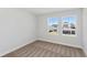 Bedroom with bright windows overlooking the neighborhood and neutral carpet at 12156 Cattleside Dr, Riverview, FL 33579