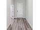 Bright hallway with gray flooring leading to the front door at 12156 Cattleside Dr, Riverview, FL 33579
