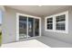 Covered patio featuring sliding glass doors and ample space for outdoor seating at 12156 Cattleside Dr, Riverview, FL 33579